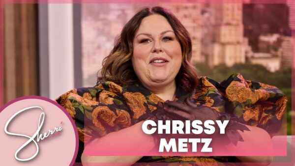 Chrissy Metz in floral dress and black lace gloves