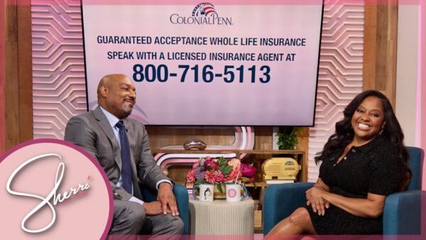 Sherri seated with Colonial Penn representative